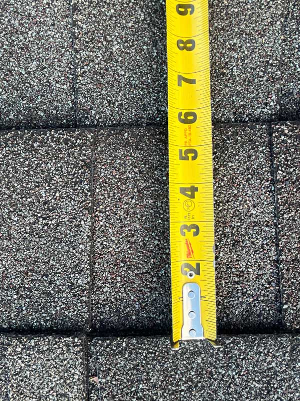 Measuring a Shingle during a Roof Inspection in Dayton Ohio