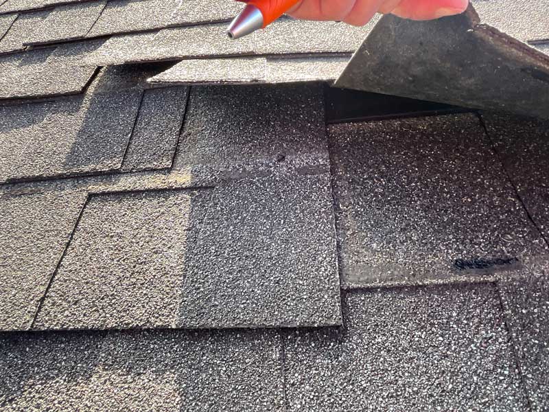 Inspecting Shingles on a Dayton Roof